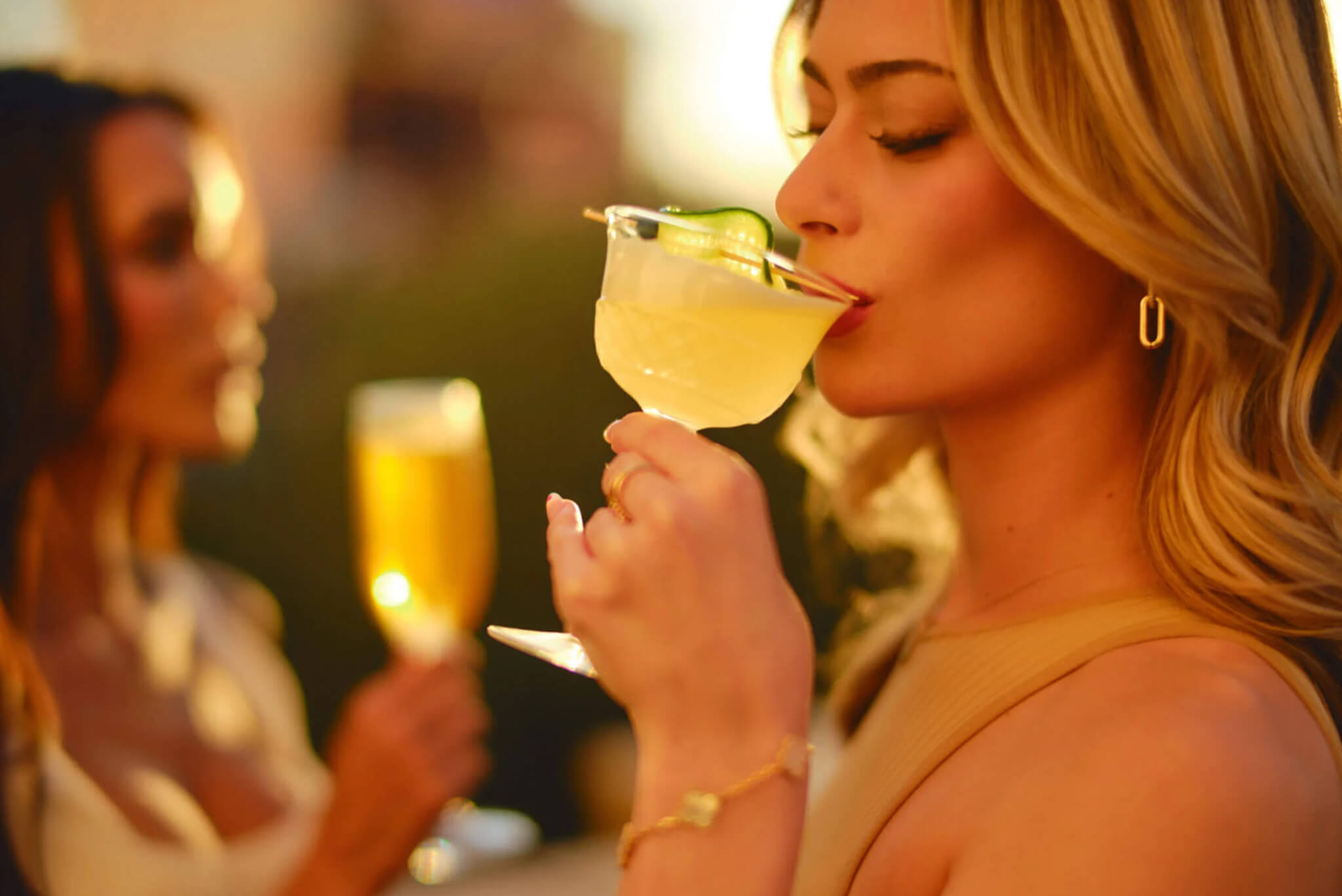 Girl sipping cocktail