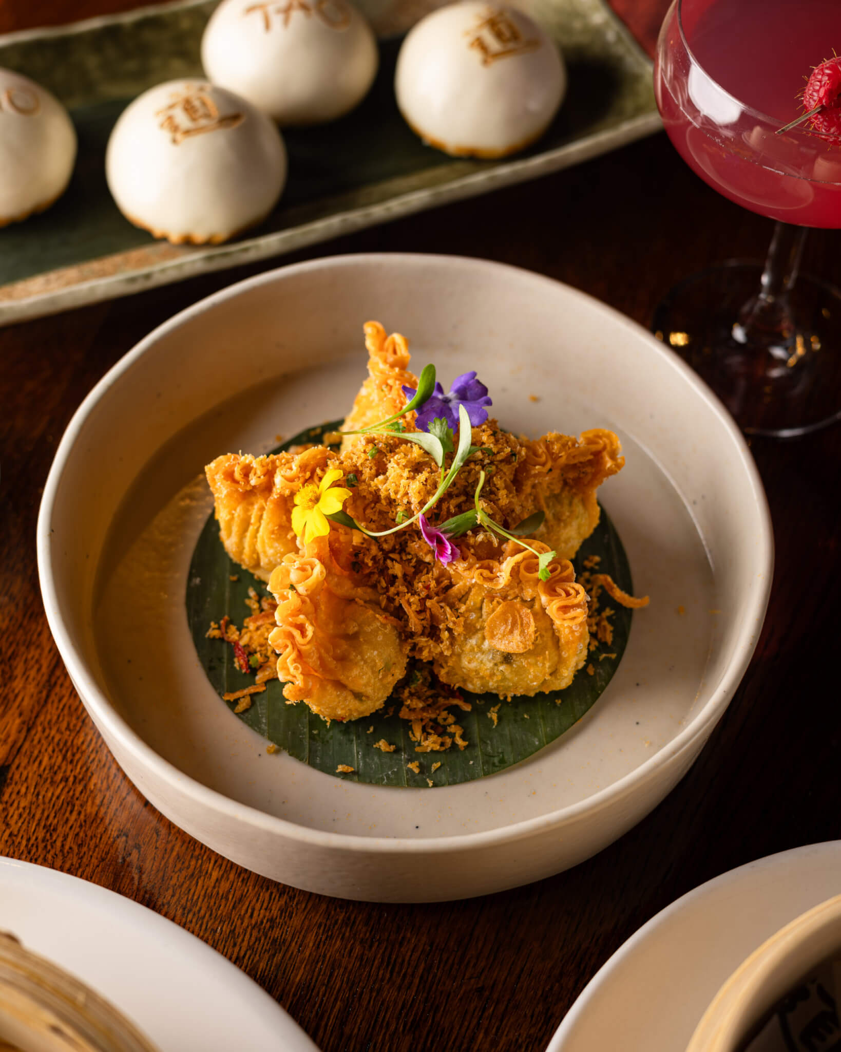 crispu wontons with floral garnish
