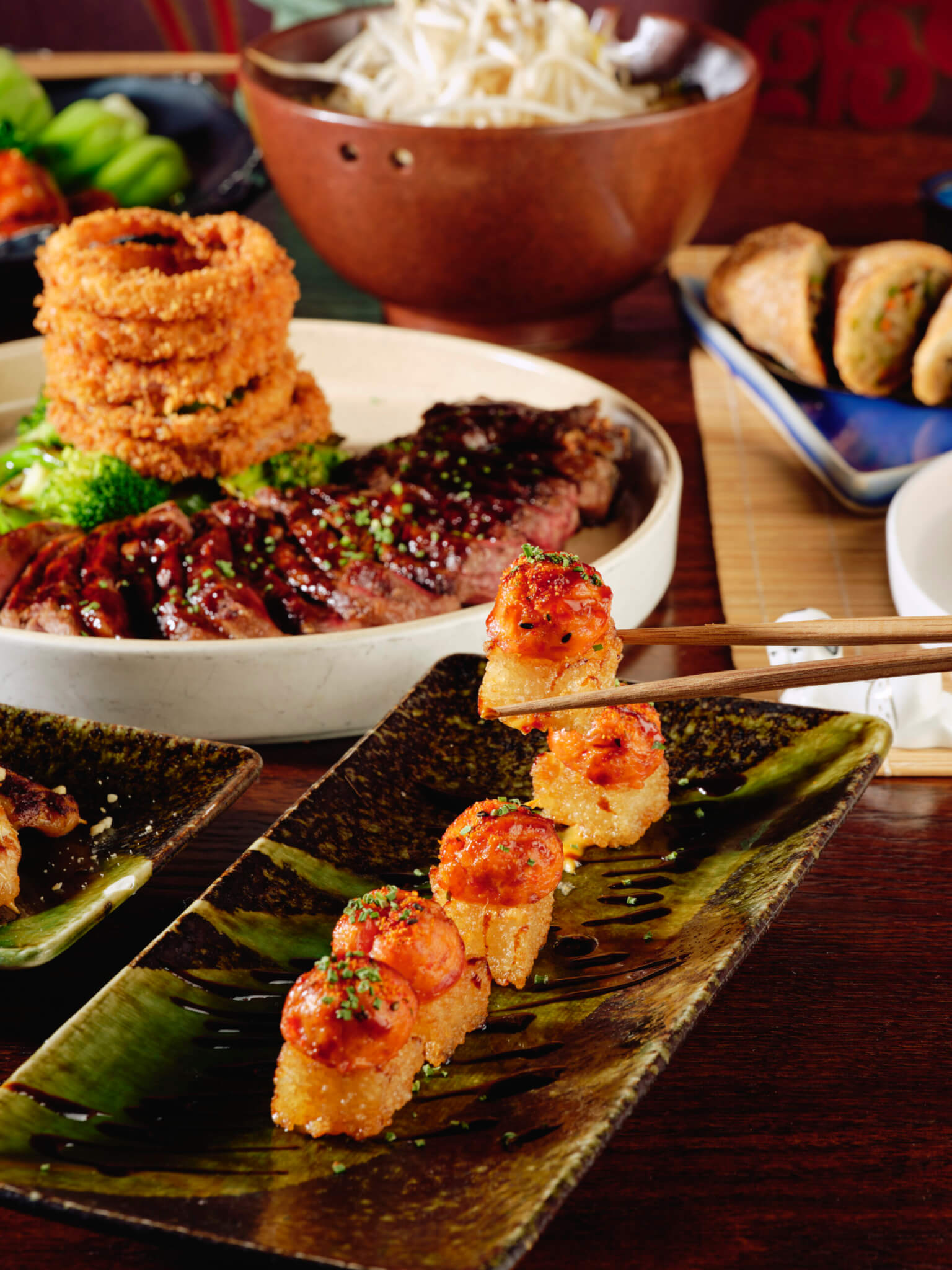 tuna on crispu rice, stak with brocoll and onion ring tower
