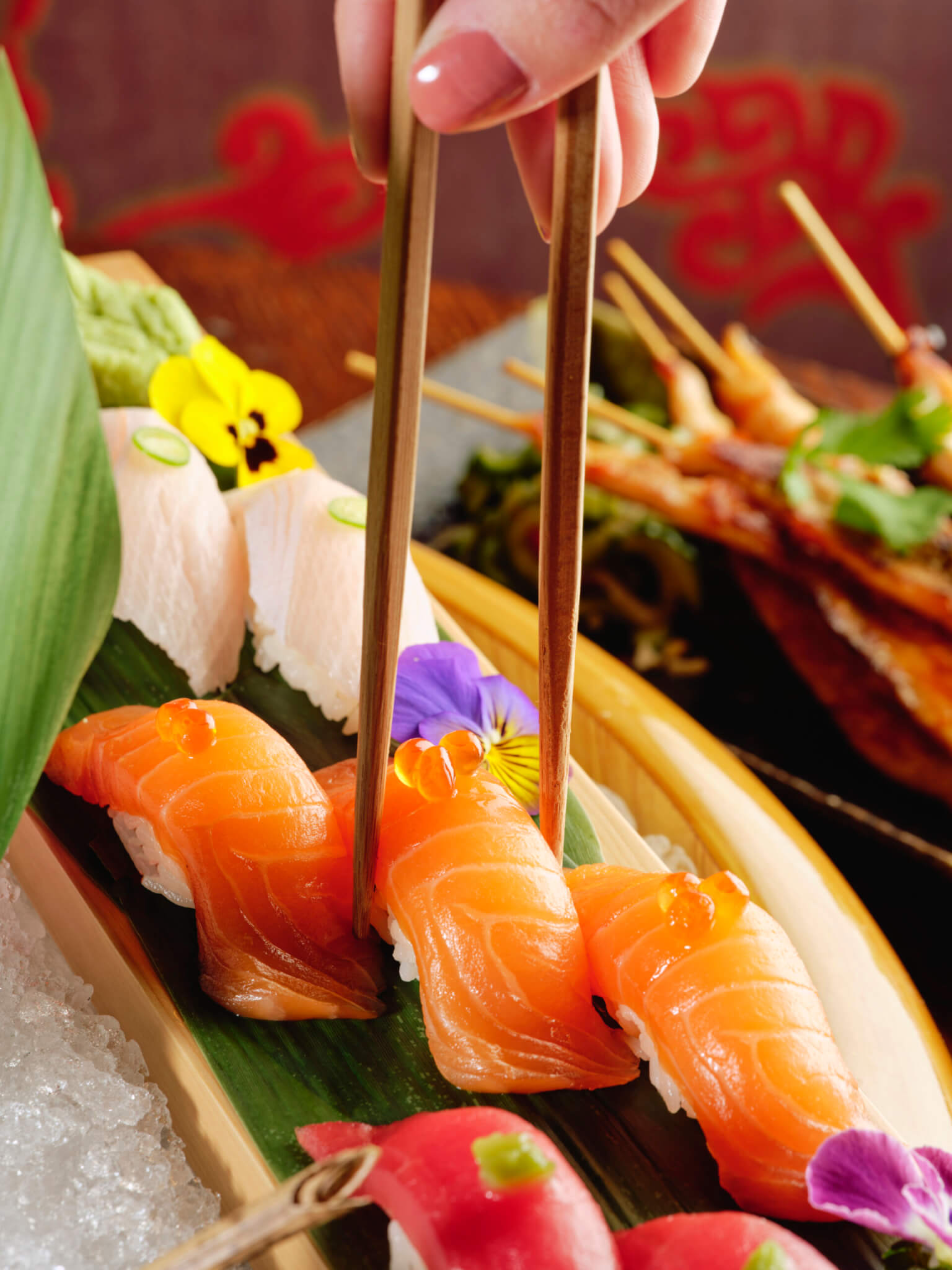 Sushi with fish egg toppings and chopsticks