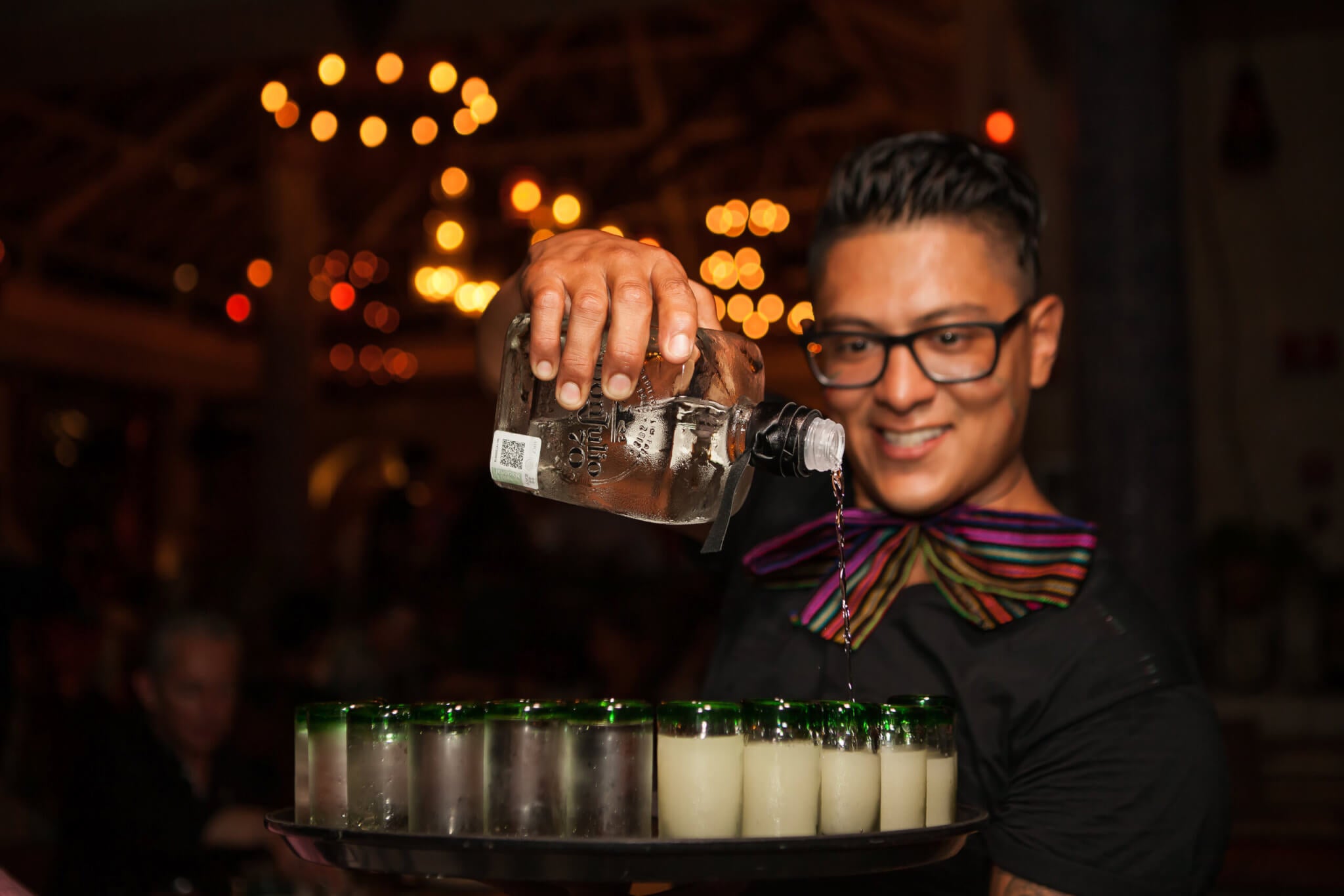 Server Pouring Tequila Shots
