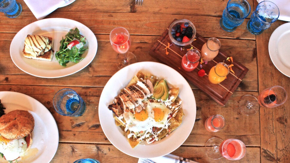Overhead Shot of Brunch Dishes with Mimosas