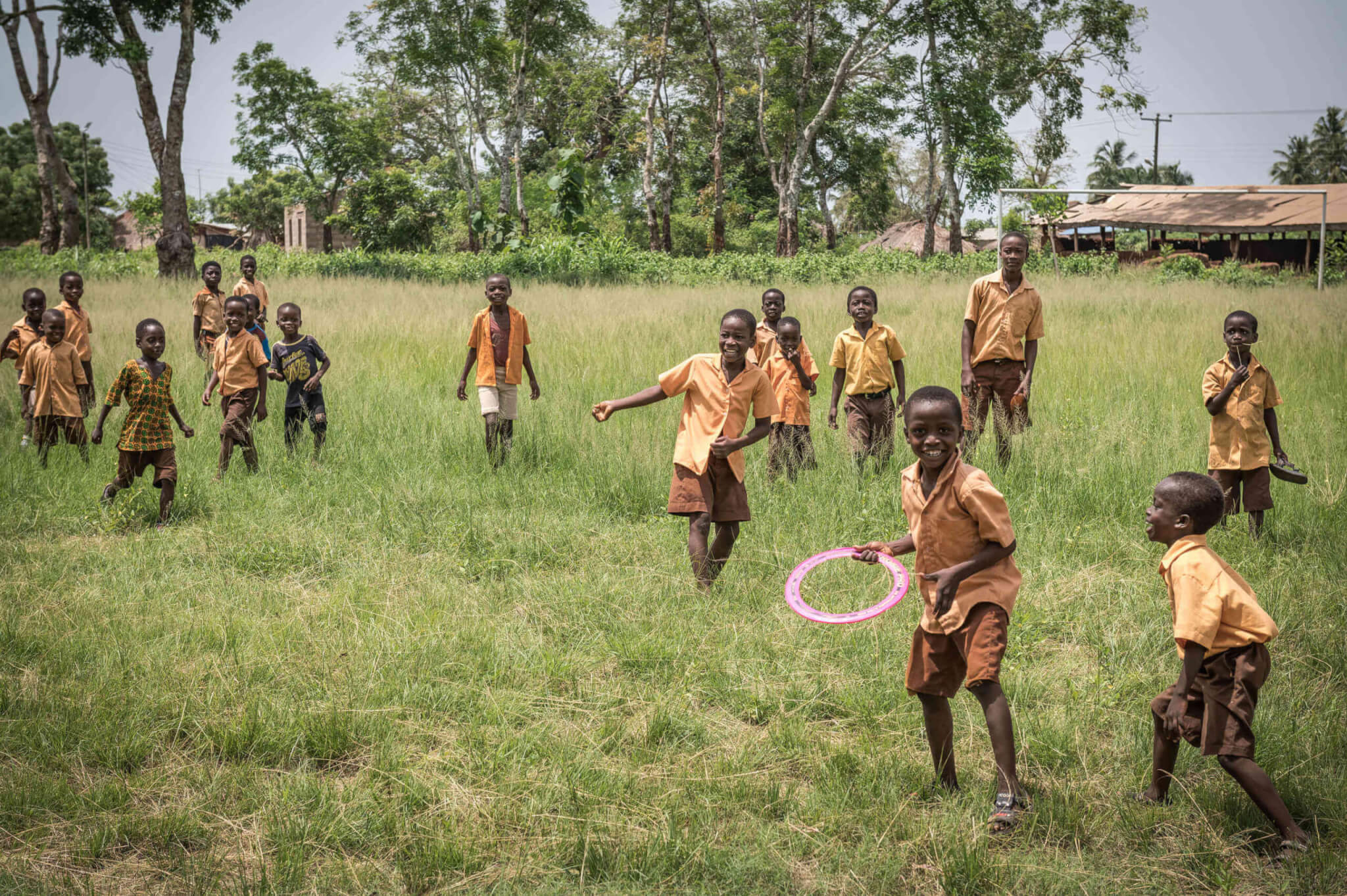 Pencils of Promise Kids playing with Frisbee