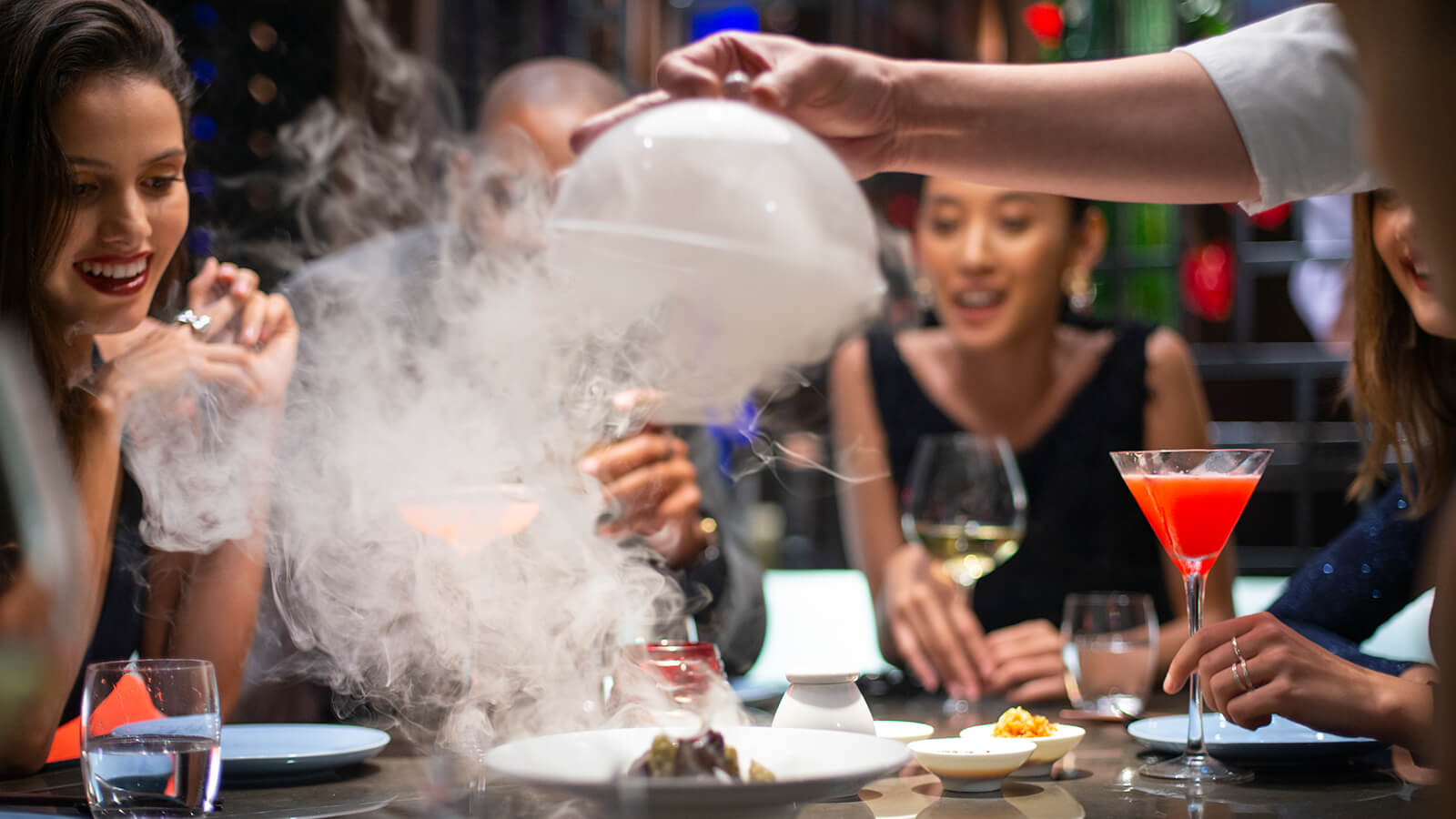 Guests with food and drinks at Hakkasan