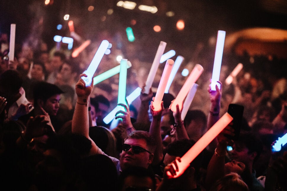 Nightclub Crowd with Glow Sticks