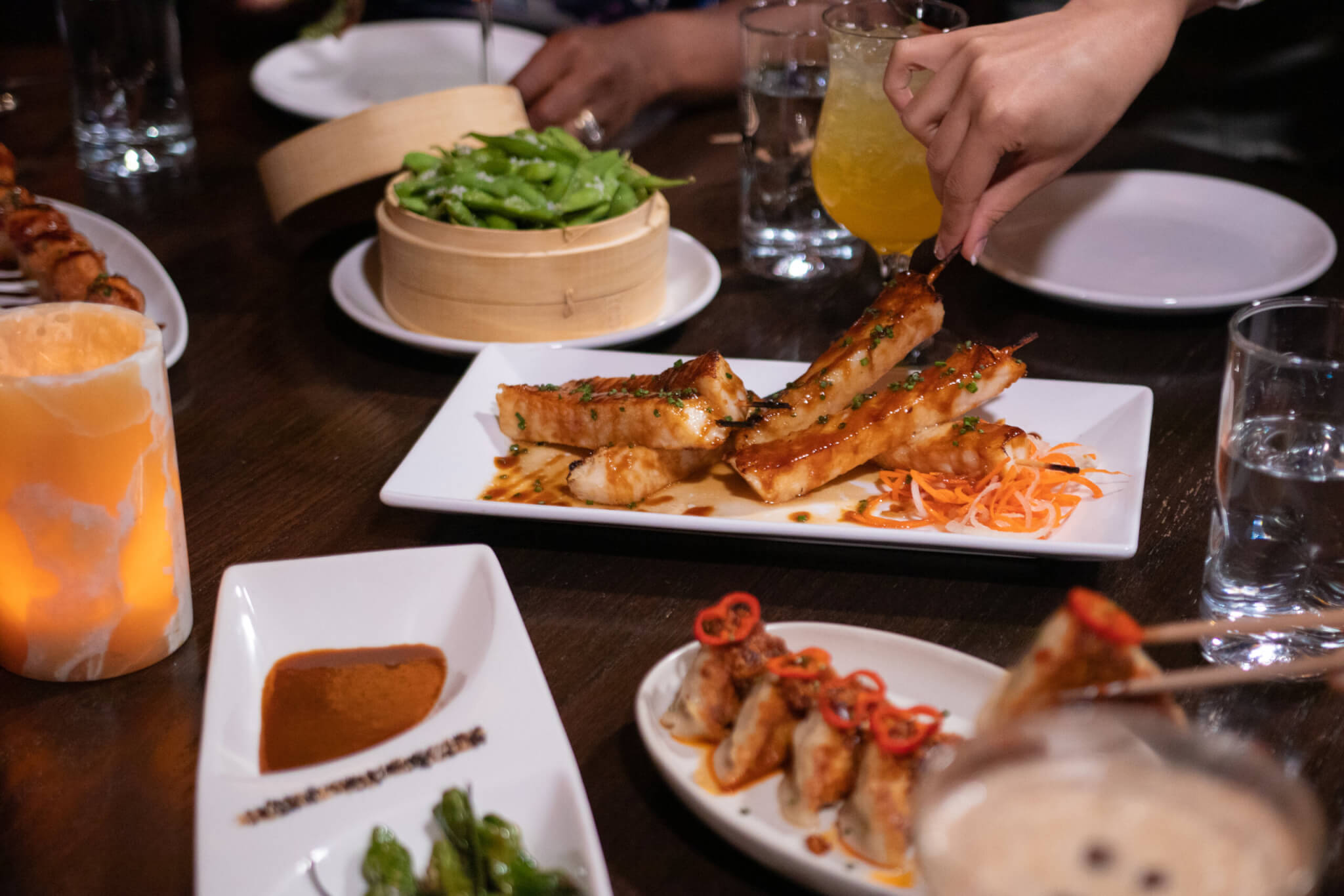 TAO Asian Bistro Las Vegas - Satay of Chicken with Peanut Sauce with edamame and dumplings