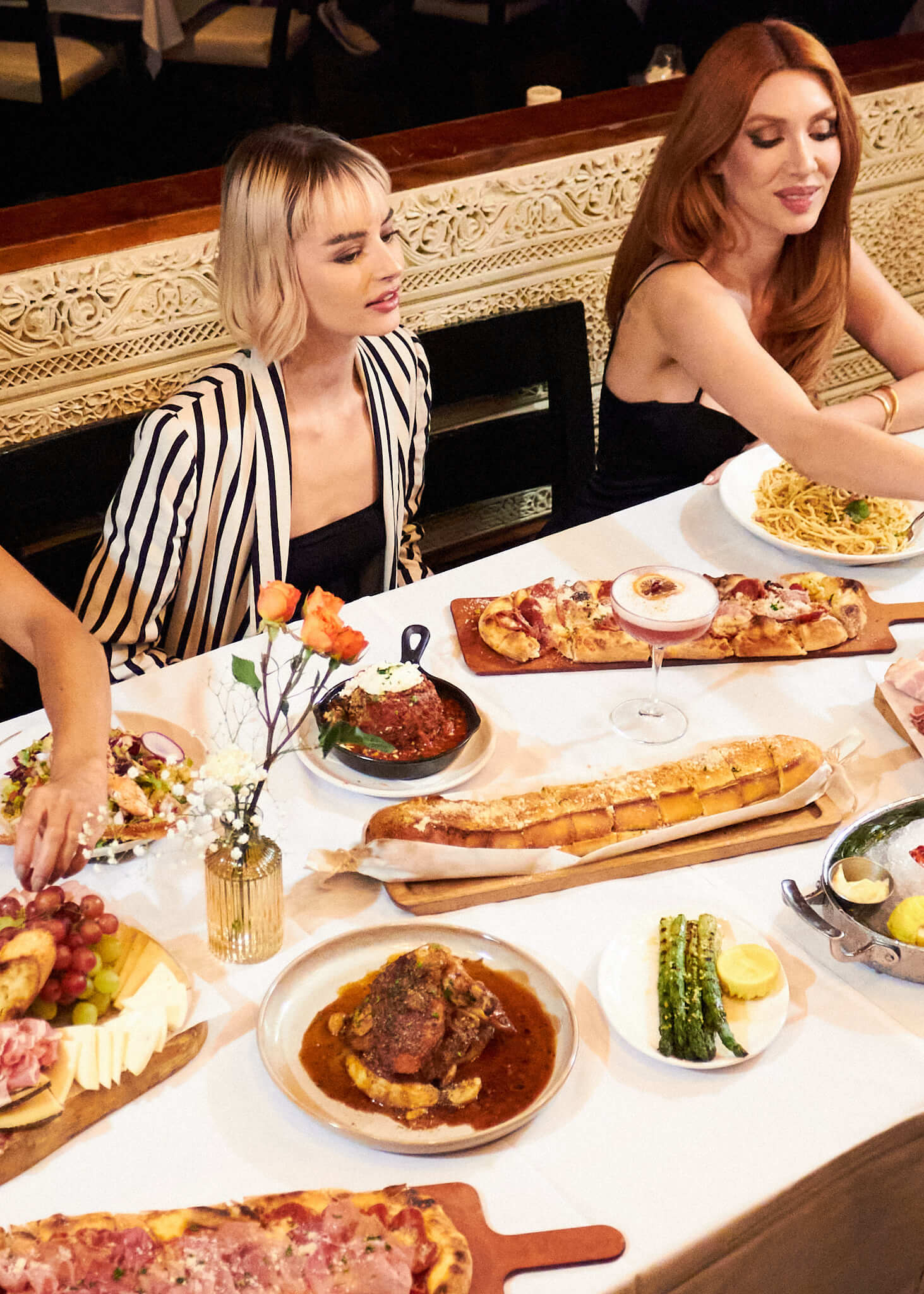 LAVO Las Vegas - Women at Table with Various Dishes