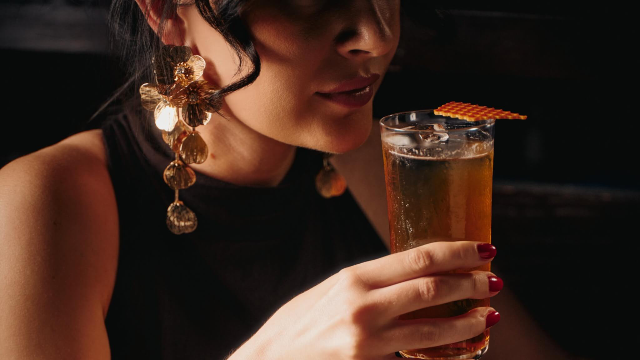 Girl with gold cocktail