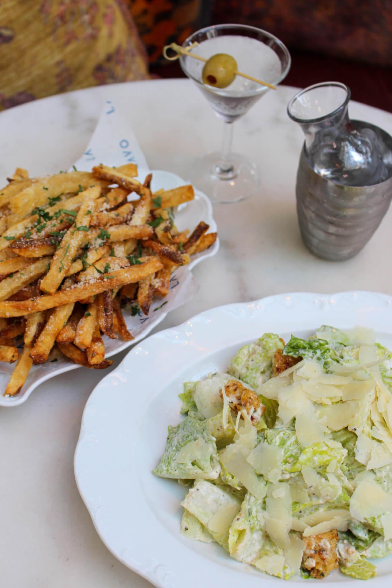 caesar salad, french fries and martini