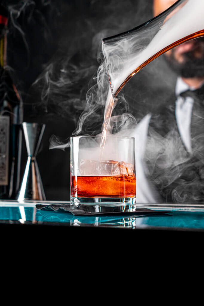 Bartender pouring a cocktail