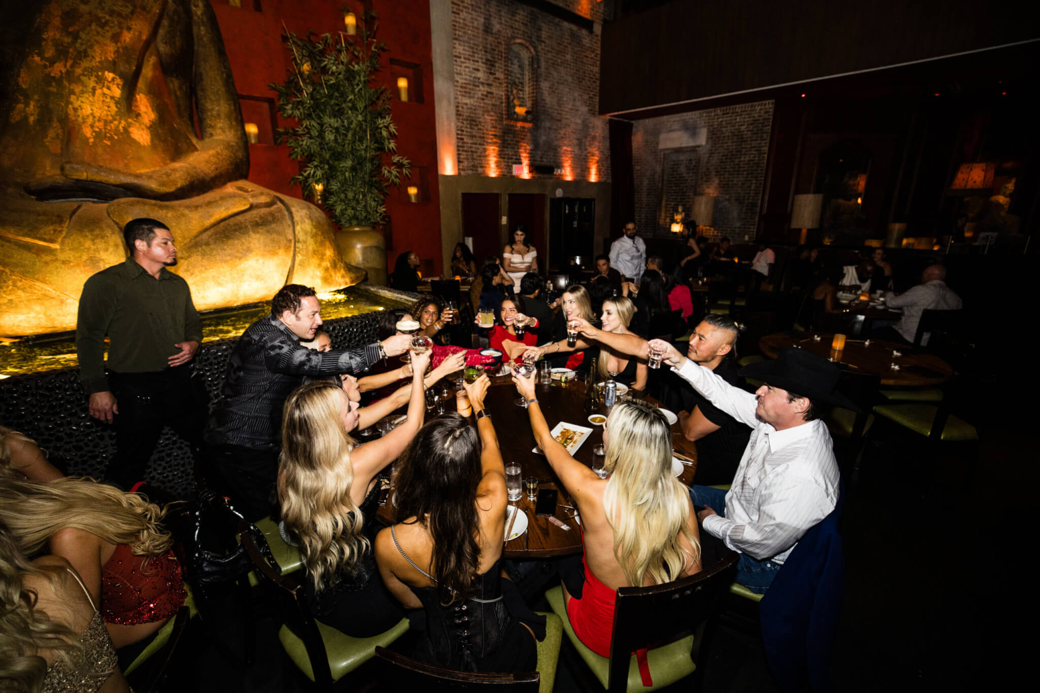 group toasting at TAO