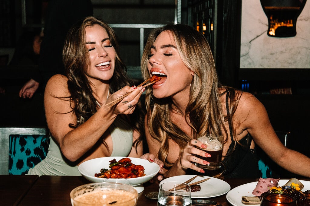 girl feeding girl