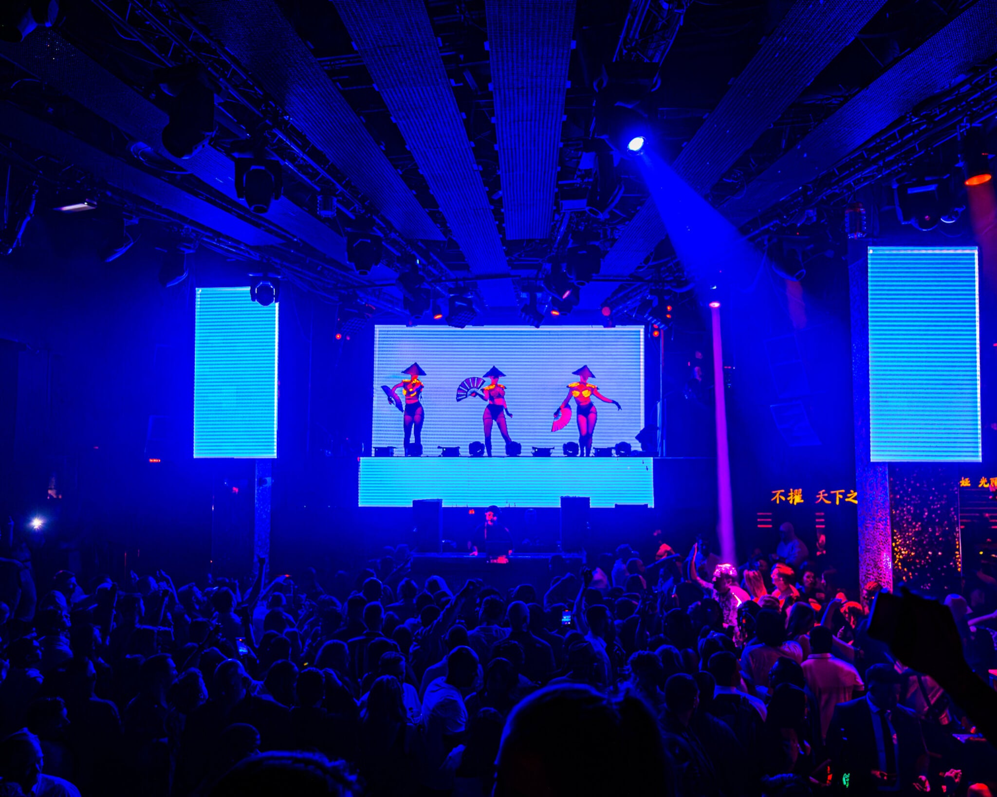 dancers on stage at TAO Nightclub in front of crowd