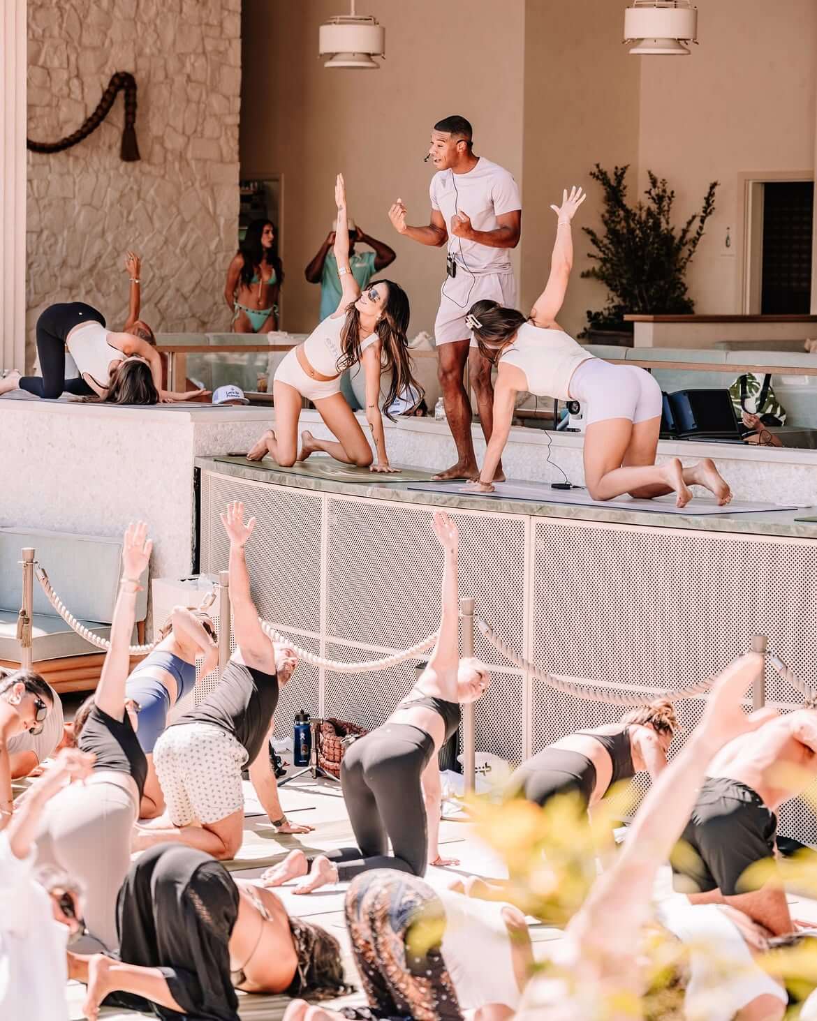 instructors doing yoga at omnia dayclub