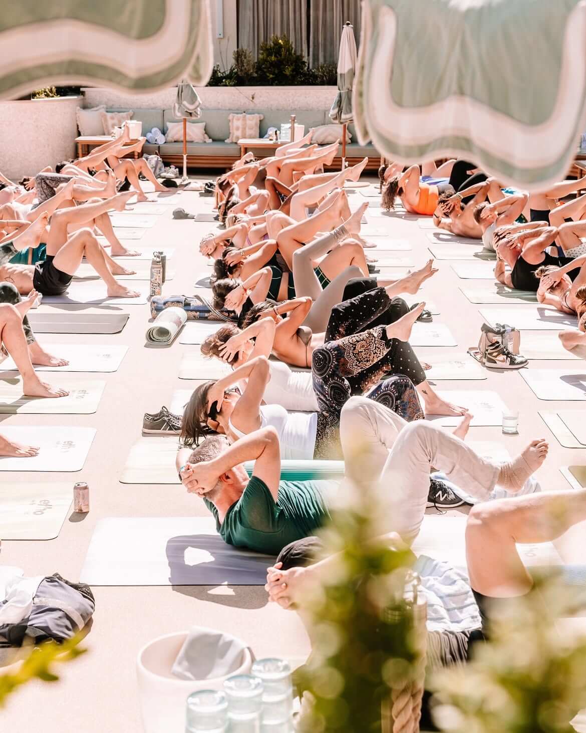 people doing yoga at omnia dayclub