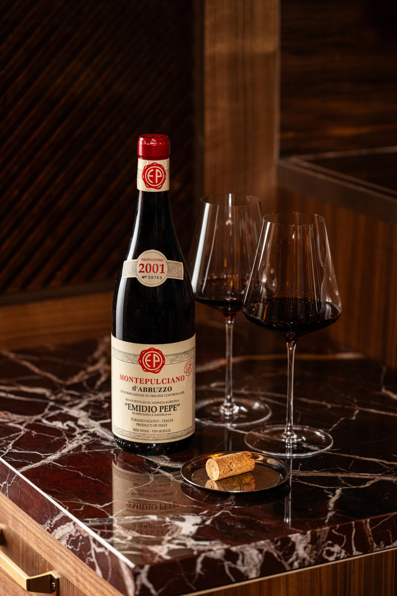 bottle of red wine with 2 glasses